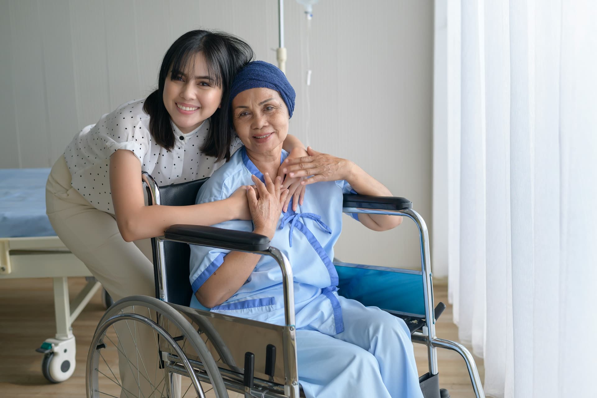Caregiver providing compassionate care to a patient at home